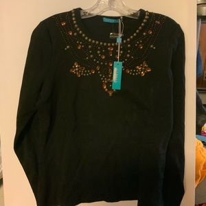 Women’s black long sleeve shirt with beads.